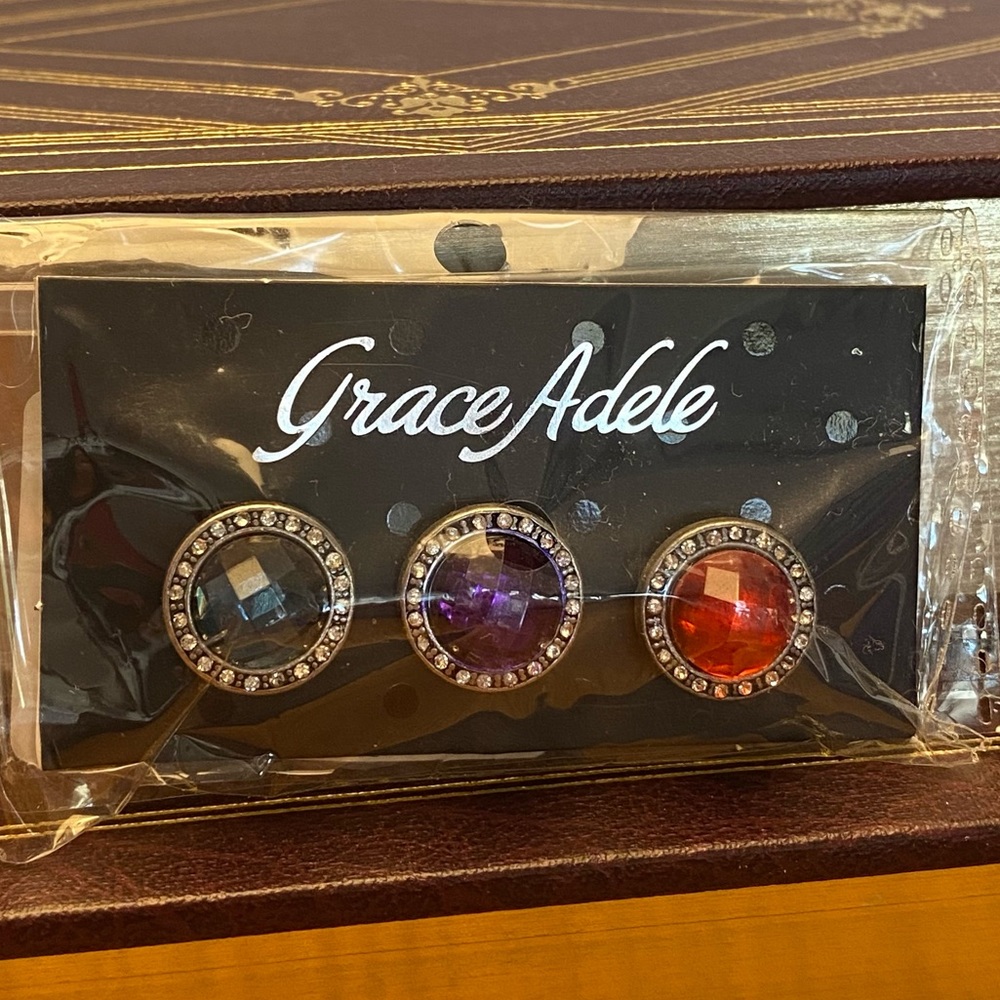 Grace Adele interchange jewel buttons in red, purple, and blue OS